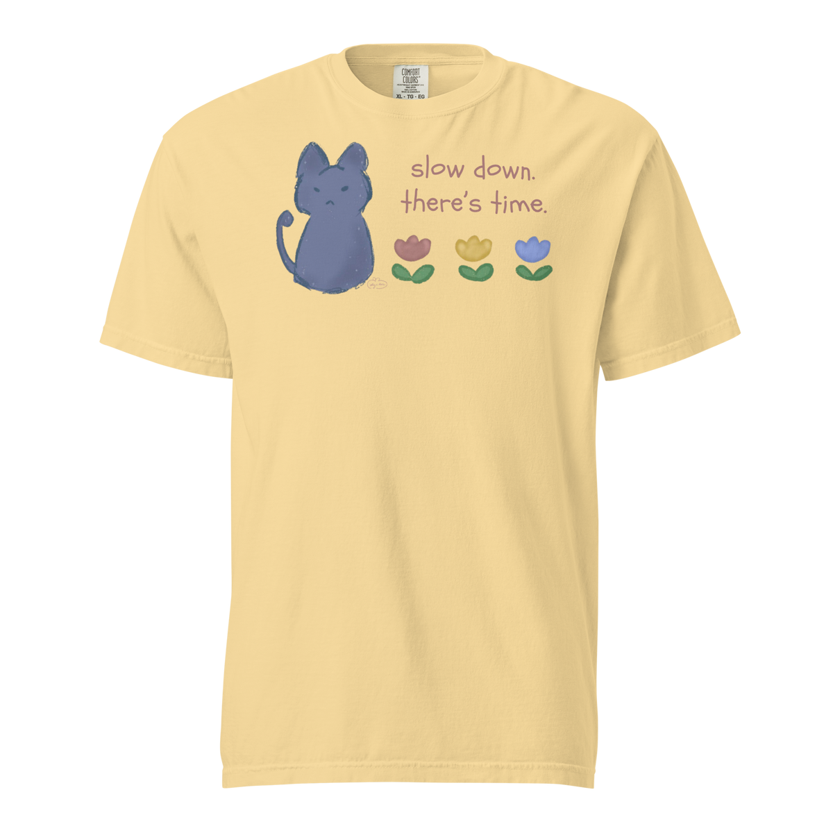 Butter yellow Comfort Colors T-shirt with a blue cat, three flowers, and 'Slow down, there's time' lettering.
