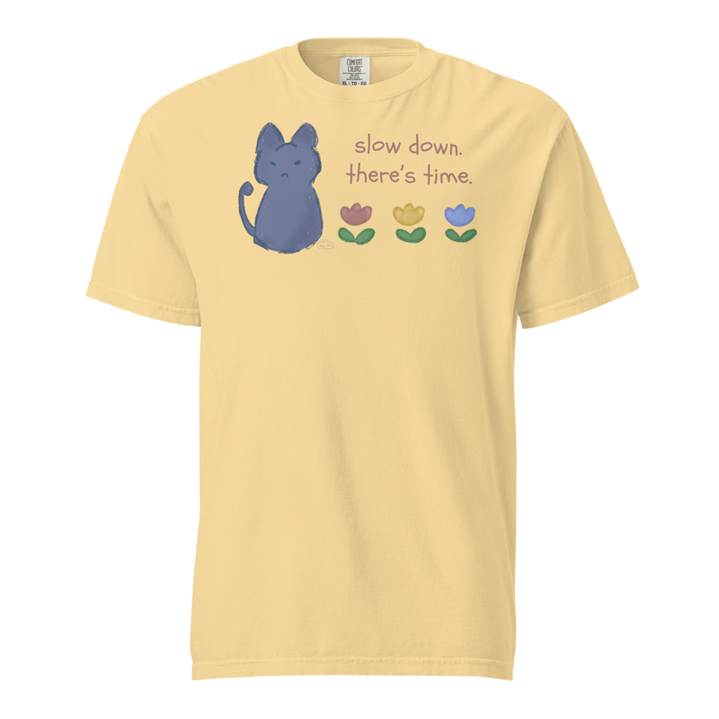 Butter yellow Comfort Colors T-shirt with a blue cat, three flowers, and 'Slow down, there's time' lettering.
