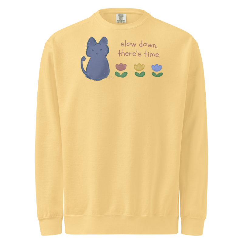Butter yellow garment-dyed sweatshirt with a blue cat, three flowers, and 'Slow down, there's time' lettering.