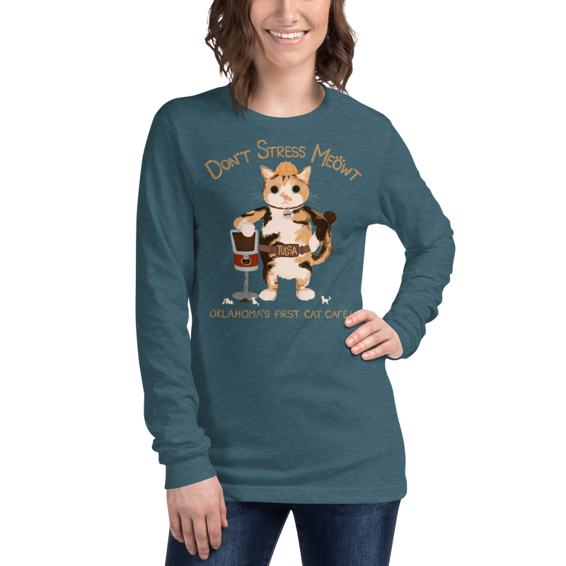 Model wearing a heather deep teal long sleeve T-shirt with a calico cowboy cat and Don't Stress Meowt cat cafe lettering.