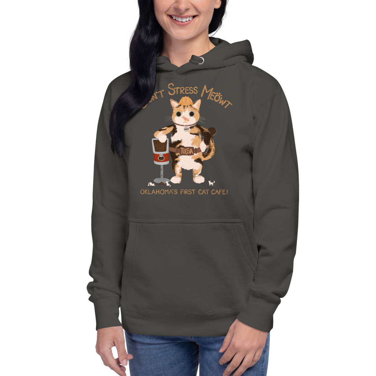 Model wearing a vintage black pullover hoodie with a calico cowboy cat and Don't Stress Meowt cat cafe lettering.