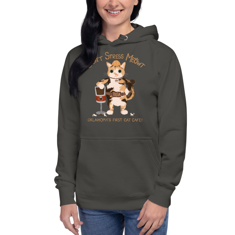 Model wearing a vintage black pullover hoodie with a calico cowboy cat and Don't Stress Meowt cat cafe lettering.