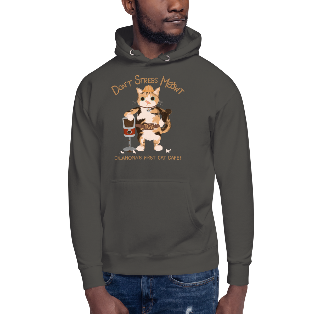 Model wearing a vintage black pullover hoodie with a calico cowboy cat and Don't Stress Meowt cat cafe lettering.