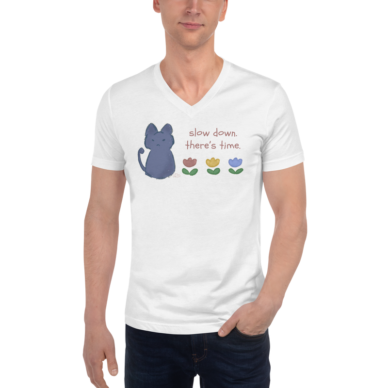 Model wearing a white V-neck T-shirt with a blue cat, three flowers, and 'Slow down, there's time' lettering.