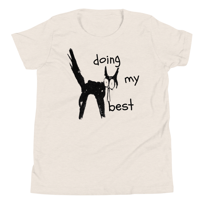 Heather dust beige youth T-shirt with a scruffy black cat with its tail raised and 'Doing my best' lettering.