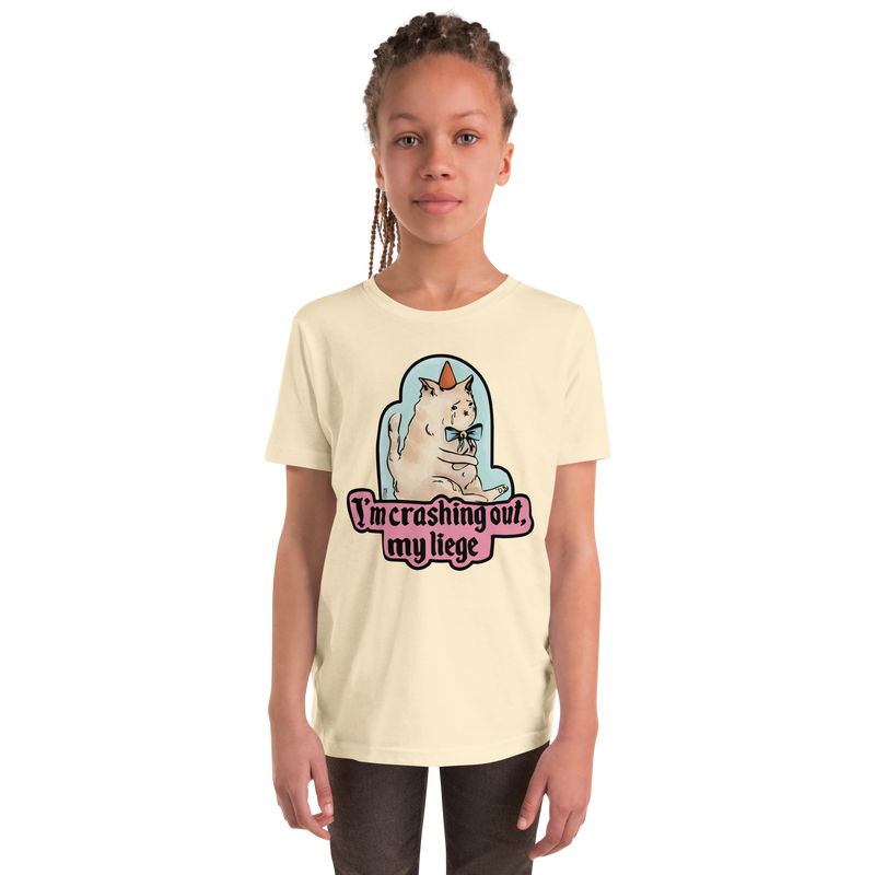 Natural cream youth T-shirt with a tearful cat in a party hat and 'I'm crashing out, my liege' lettering.