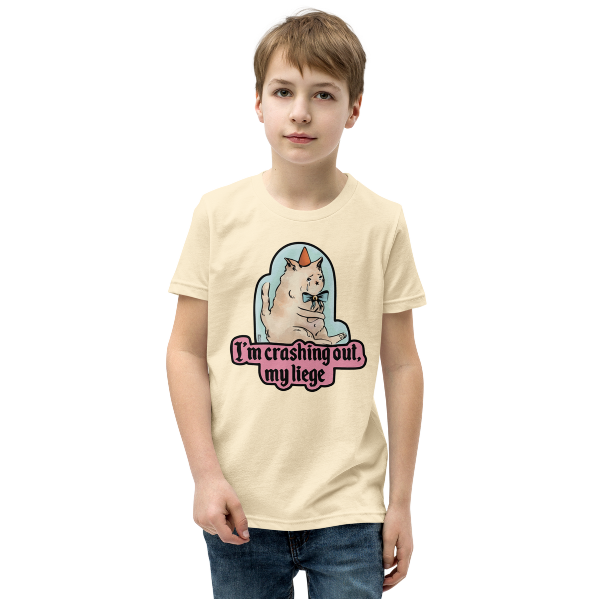 Natural cream youth T-shirt with a tearful cat in a party hat and 'I'm crashing out, my liege' lettering.